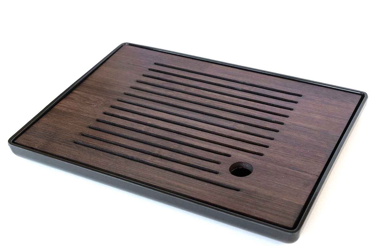 Dark brown tea tray on white background