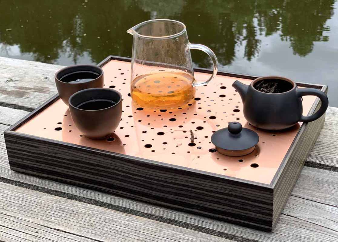 Tea ceremony by the lake. Classic gong fu style tea brewing.